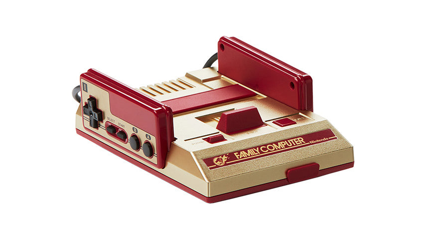 Nintendo Famicom Mini Shonen Jump gold console with two attached controllers