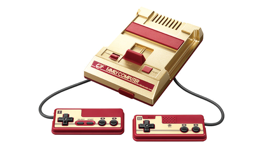 Nintendo Famicom Mini Shonen Jump gold console with two attached controllers